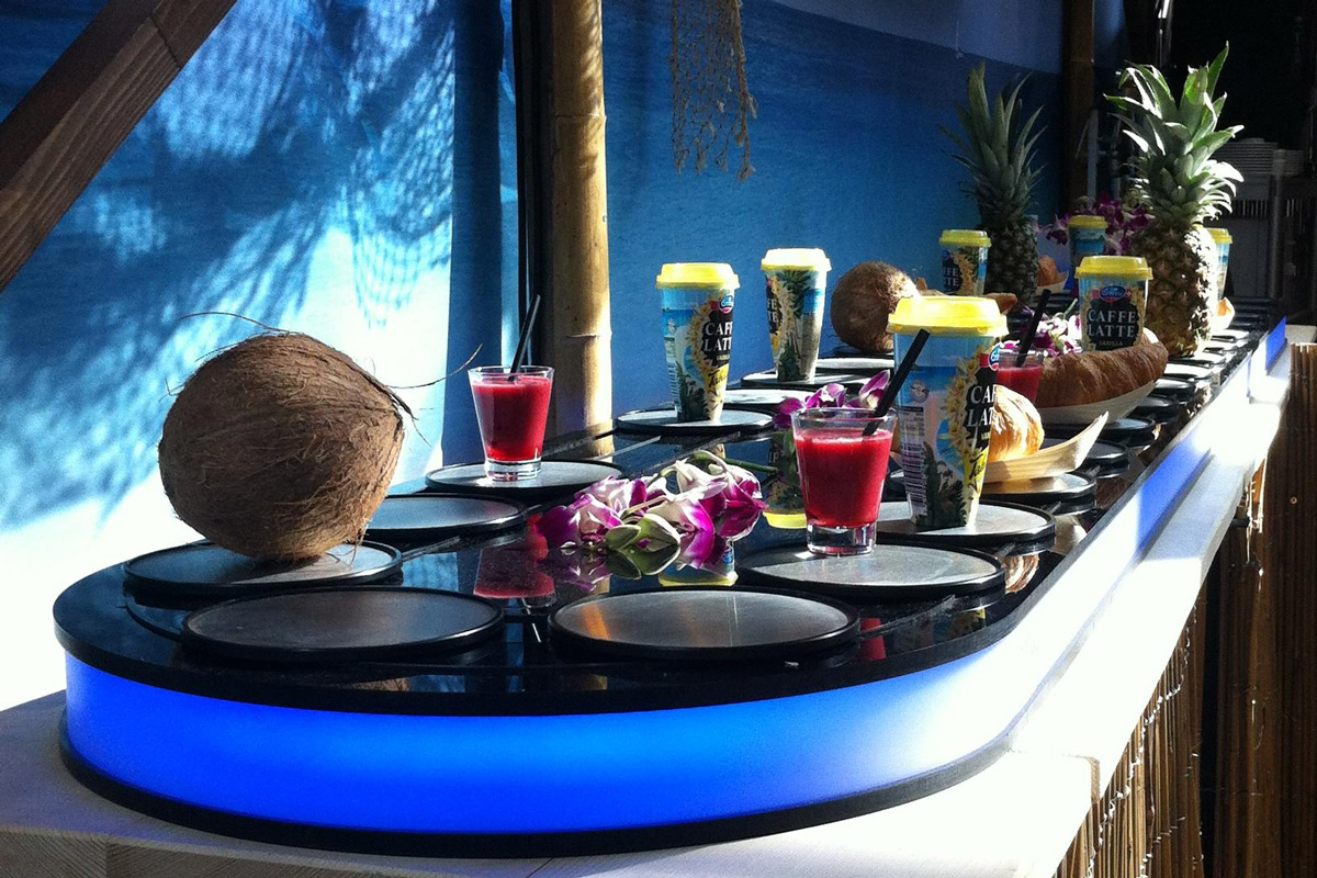 Stunning wedding catering conveyor setup in Delhi NCR with desserts and mocktails, guests taking photos